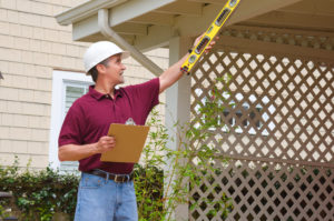 a general contractor checking a home's roof