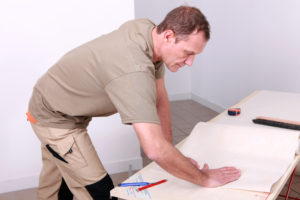 a general contractor looking over plans for an upcoming project