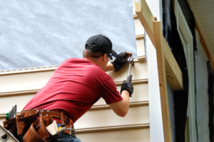 home remodeling man working on a home's walls