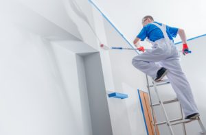 professional painters painting a wall